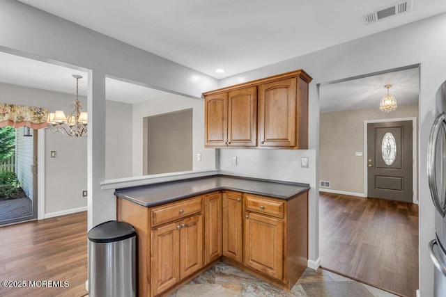 5 Beth Dr, Middletown, NJ 07748 - kitchen with baseboards, an inviting chandelier, wood finished floors, and visible vents