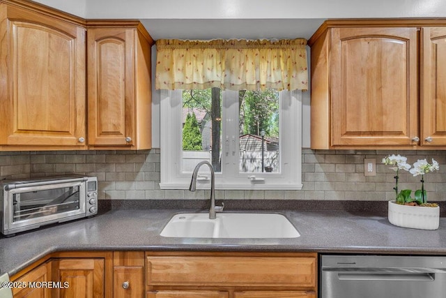 5 Beth Dr, Middletown, NJ 07748 - kitchen featuring a toaster, dark countertops, tasteful backsplash, a sink, and dishwasher
