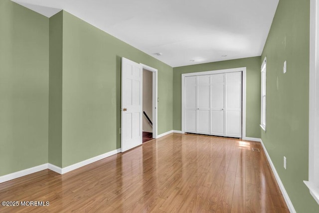 5 Beth Dr, Middletown, NJ 07748 - unfurnished bedroom with baseboards, a closet, and wood finished floors