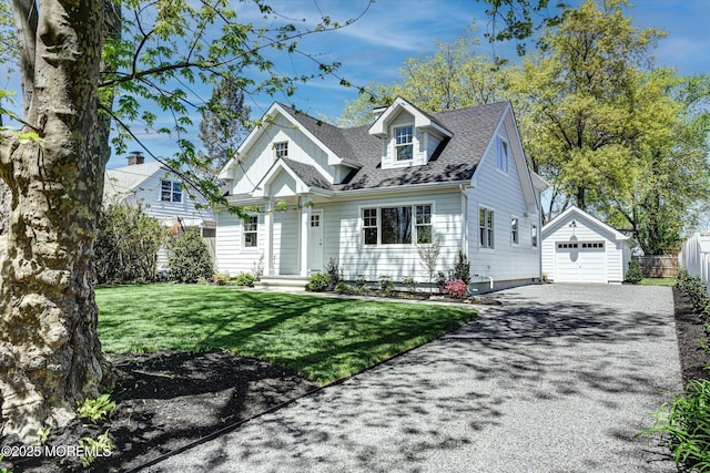 26 Rumson Pl, Little Silver, NJ 07739 - new england style home featuring an outdoor structure, a front lawn, a shingled roof, driveway, and a detached garage