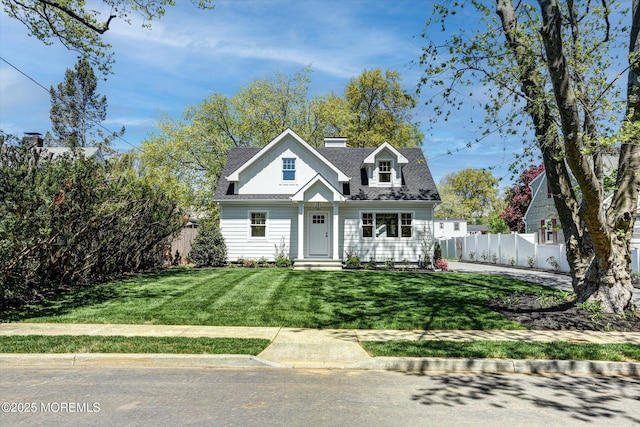 26 Rumson Pl, Little Silver, NJ 07739 - view of front of house with fence, a chimney, and a front lawn