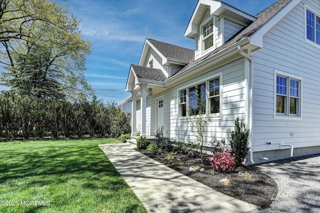 26 Rumson Pl, Little Silver, NJ 07739 - view of side of property with a lawn and roof with shingles