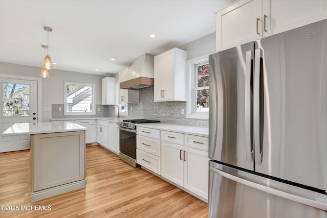 26 Rumson Pl, Little Silver, NJ 07739 - kitchen featuring appliances with stainless steel finishes, a sink, light countertops, custom exhaust hood, and light wood-style floors