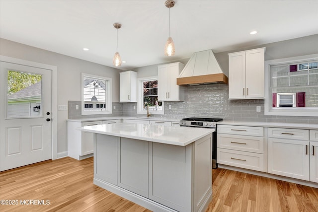 26 Rumson Pl, Little Silver, NJ 07739 - kitchen with custom exhaust hood, gas range, light wood-type flooring, tasteful backsplash, and a sink