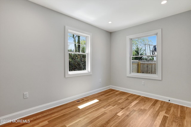 26 Rumson Pl, Little Silver, NJ 07739 - unfurnished room featuring baseboards, recessed lighting, light wood-style flooring, and a wealth of natural light