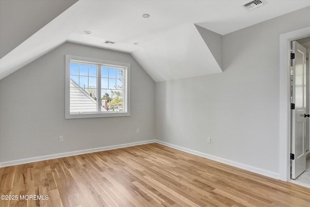 26 Rumson Pl, Little Silver, NJ 07739 - bonus room featuring visible vents, baseboards, light wood finished floors, and lofted ceiling