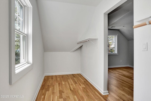 26 Rumson Pl, Little Silver, NJ 07739 - additional living space featuring light wood-type flooring, baseboards, and vaulted ceiling