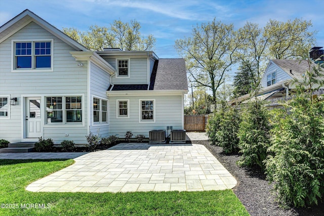 26 Rumson Pl, Little Silver, NJ 07739 - rear view of property featuring a patio, central AC, a shingled roof, and a fenced backyard