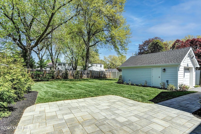 26 Rumson Pl, Little Silver, NJ 07739 - view of patio / terrace with a garage, a fenced backyard, and an outbuilding