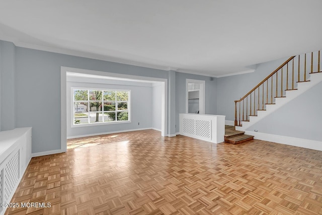 unfurnished living room featuring baseboards, ornamental molding, and stairway