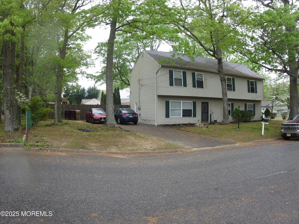 52 Cranmer Rd, Bayville, NJ 08721 - view of front facade featuring fence and driveway