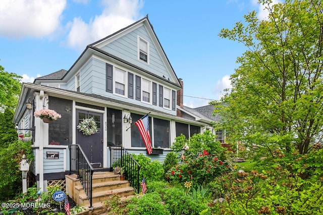 820 Trenton Ave, Point Pleasant, NJ 08742 - view of front of house featuring a sunroom and roof with shingles