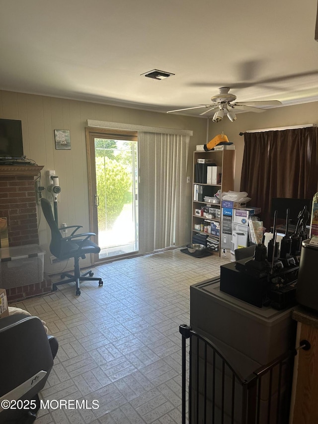 interior space featuring a ceiling fan, tile patterned floors, and visible vents