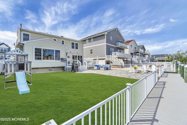 exterior space with a fenced backyard, a patio area, crawl space, and a residential view
