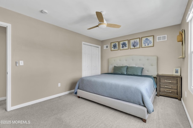 bedroom with visible vents, carpet flooring, and a closet