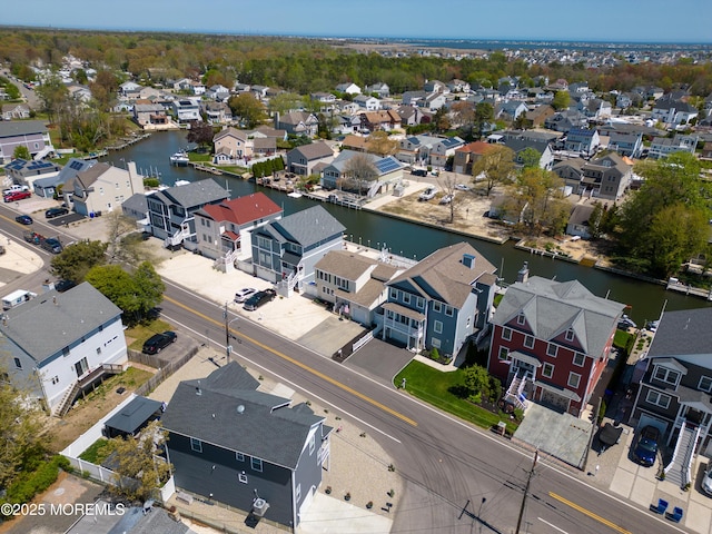 aerial view with a water view and a residential view