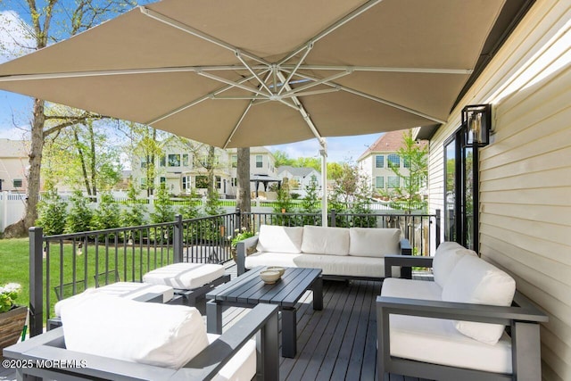 deck featuring a residential view, a yard, and an outdoor hangout area