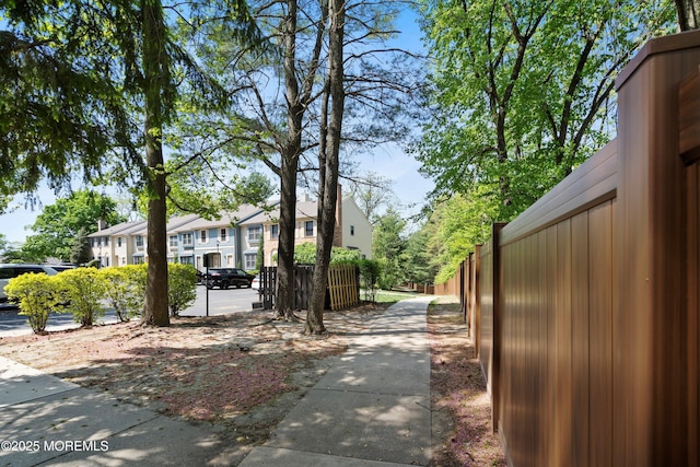 exterior space with a residential view and fence