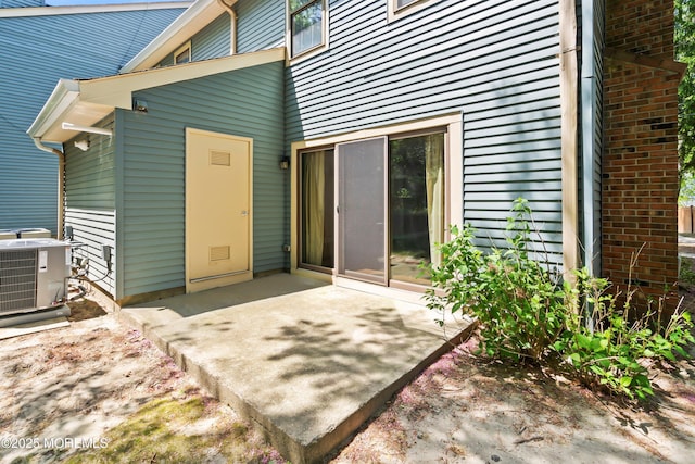 property entrance with central AC and a patio area