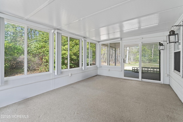 unfurnished sunroom with a wealth of natural light
