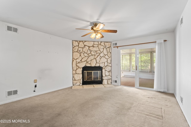 unfurnished living room with visible vents, carpet, and ceiling fan