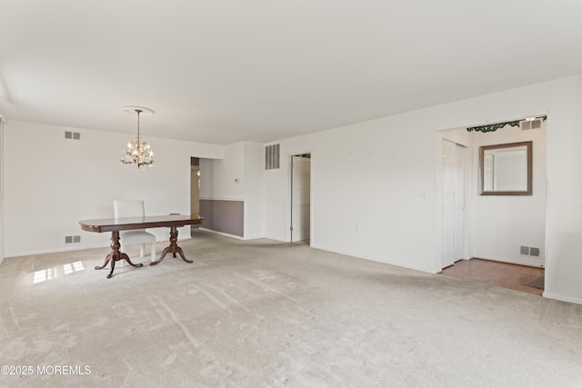 interior space with visible vents and light colored carpet