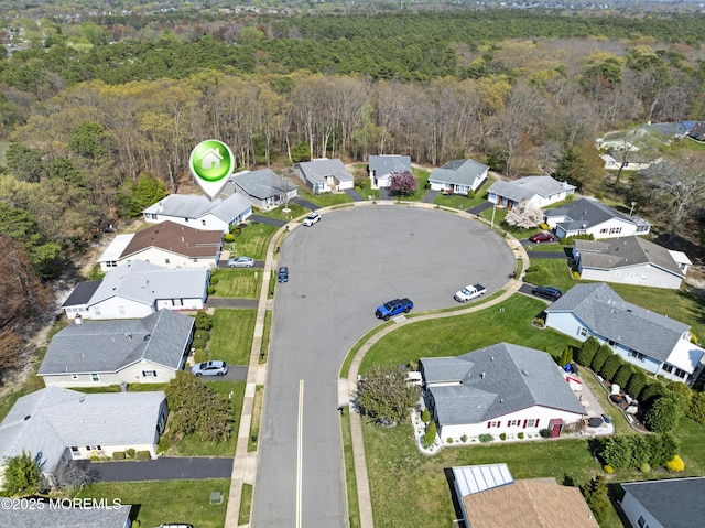 aerial view featuring a residential view and a forest view