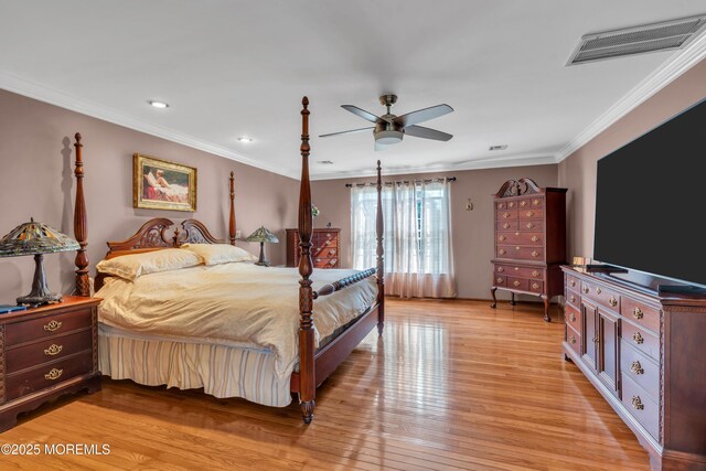 bedroom featuring visible vents, ornamental molding, recessed lighting, and light wood-type flooring