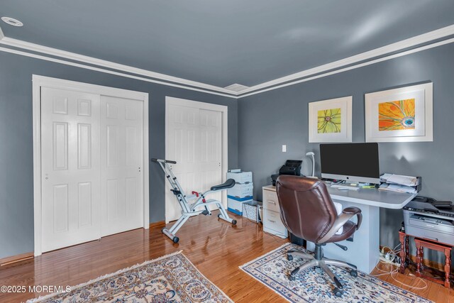 office featuring crown molding and wood finished floors