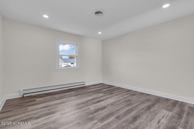 17 Norfolk Dr, Toms River, NJ 08757 - spare room featuring a baseboard radiator, wood finished floors, recessed lighting, and baseboards