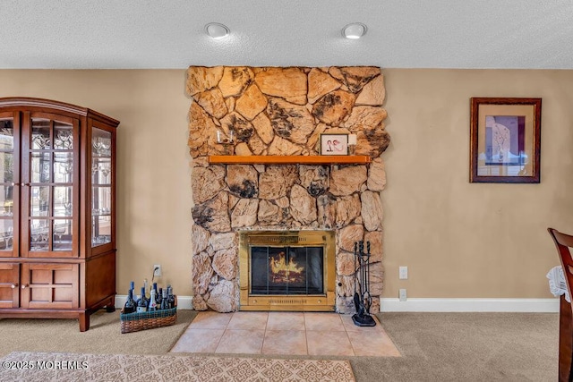 unfurnished living room featuring carpet flooring, a textured ceiling, and a stone fireplace