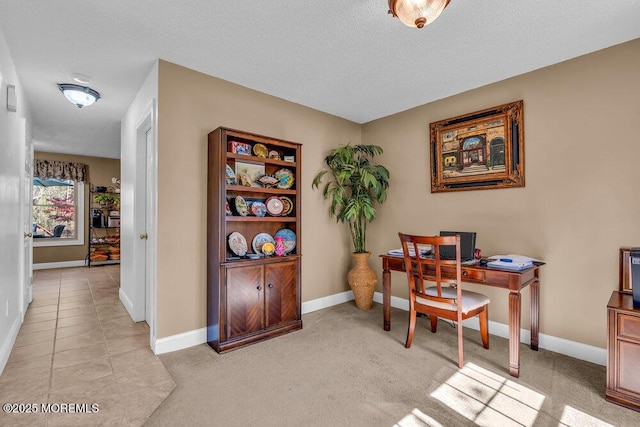 office featuring a textured ceiling and baseboards