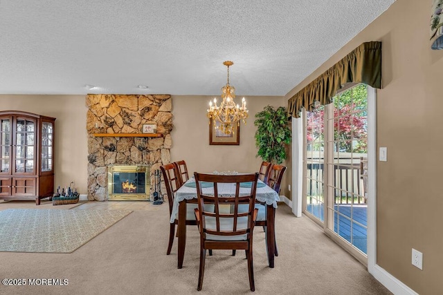 dining area featuring plenty of natural light, light colored carpet, a textured ceiling, and a notable chandelier