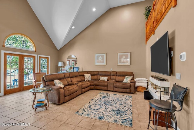 living room with light tile patterned flooring, high vaulted ceiling, recessed lighting, and french doors