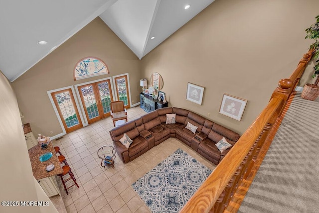 living area featuring tile patterned flooring, high vaulted ceiling, french doors, recessed lighting, and baseboards