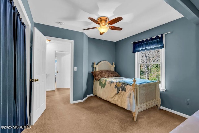 bedroom featuring baseboards, carpet flooring, and a ceiling fan
