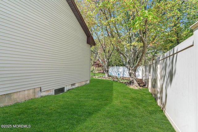 view of yard with a fenced backyard