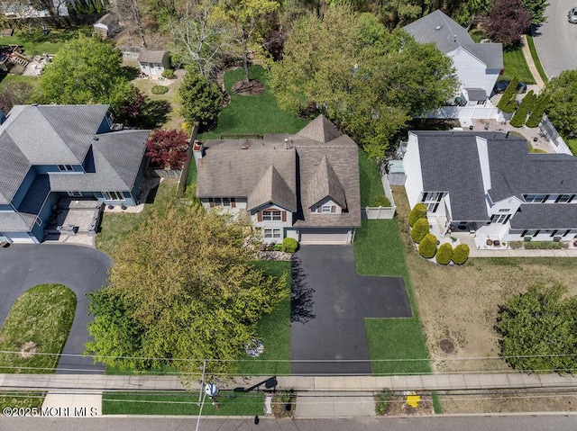 birds eye view of property with a residential view