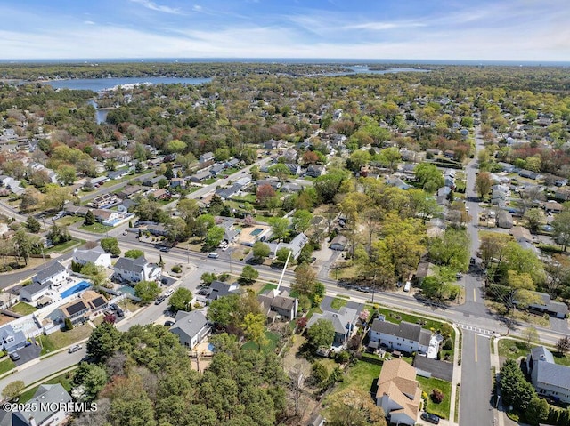 aerial view with a water view and a residential view