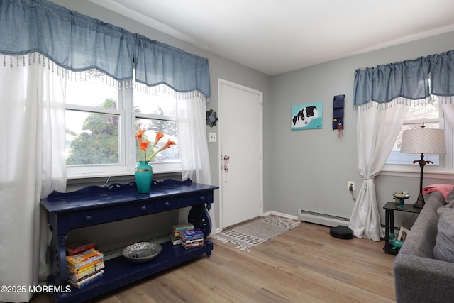 471 Saint Thomas Dr, Toms River, NJ 08757 - foyer entrance featuring a baseboard heating unit, wood finished floors, and a wealth of natural light