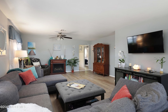 471 Saint Thomas Dr, Toms River, NJ 08757 - living area with visible vents, a fireplace, baseboards, ceiling fan, and light wood-style flooring