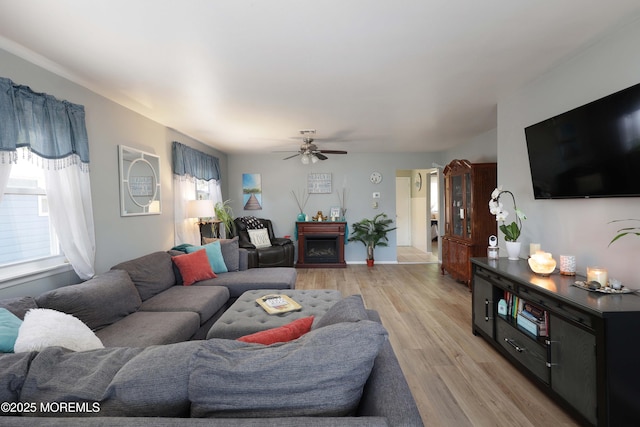 471 Saint Thomas Dr, Toms River, NJ 08757 - living area with a fireplace, a ceiling fan, and light wood-style floors