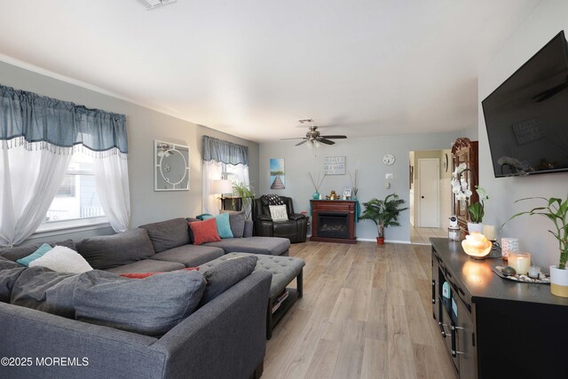 471 Saint Thomas Dr, Toms River, NJ 08757 - living area with plenty of natural light, light wood-style flooring, ceiling fan, and a fireplace