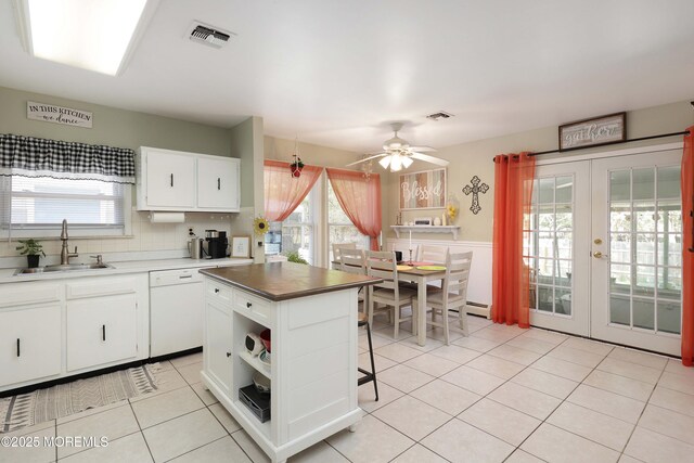 471 Saint Thomas Dr, Toms River, NJ 08757 - kitchen featuring light tile patterned flooring, a sink, french doors, a ceiling fan, and visible vents