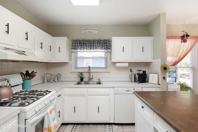 471 Saint Thomas Dr, Toms River, NJ 08757 - kitchen featuring a sink, tasteful backsplash, under cabinet range hood, and white appliances