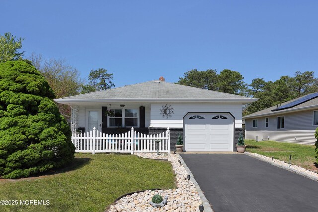 471 Saint Thomas Dr, Toms River, NJ 08757 - view of front of property with fence, an attached garage, aphalt driveway, a front yard, and a chimney