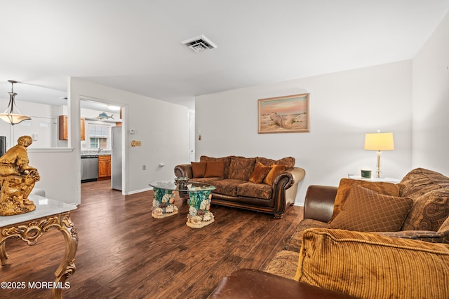 119B Buckingham Dr, Lakewood, NJ 08701 - living room with visible vents, dark wood finished floors, and baseboards