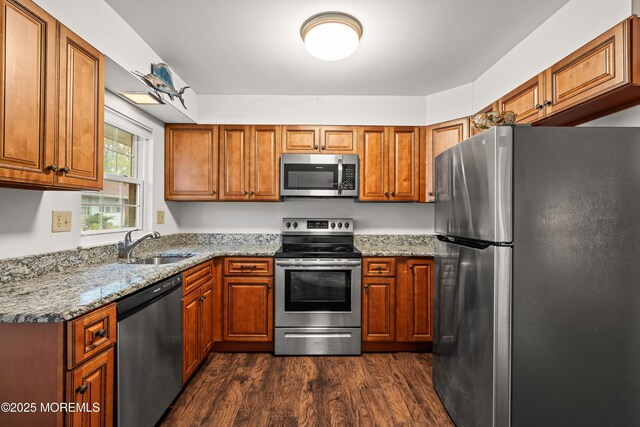 119B Buckingham Dr, Lakewood, NJ 08701 - kitchen featuring dark wood-style flooring, stainless steel appliances, brown cabinetry, and a sink