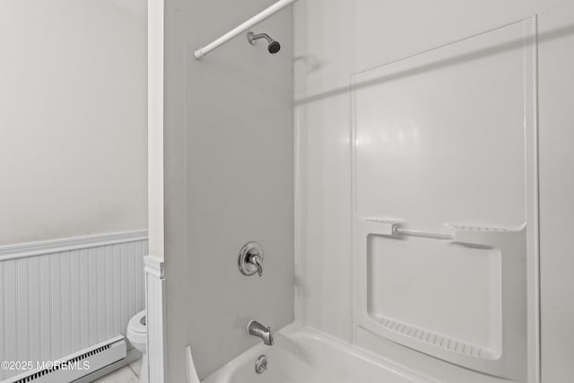 119B Buckingham Dr, Lakewood, NJ 08701 - full bathroom featuring wainscoting, a baseboard heating unit, toilet, and bathtub / shower combination