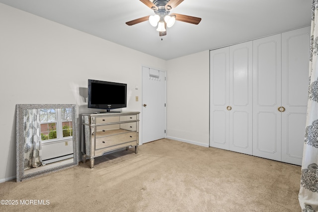 119B Buckingham Dr, Lakewood, NJ 08701 - carpeted bedroom with baseboards, a baseboard radiator, ceiling fan, and a closet